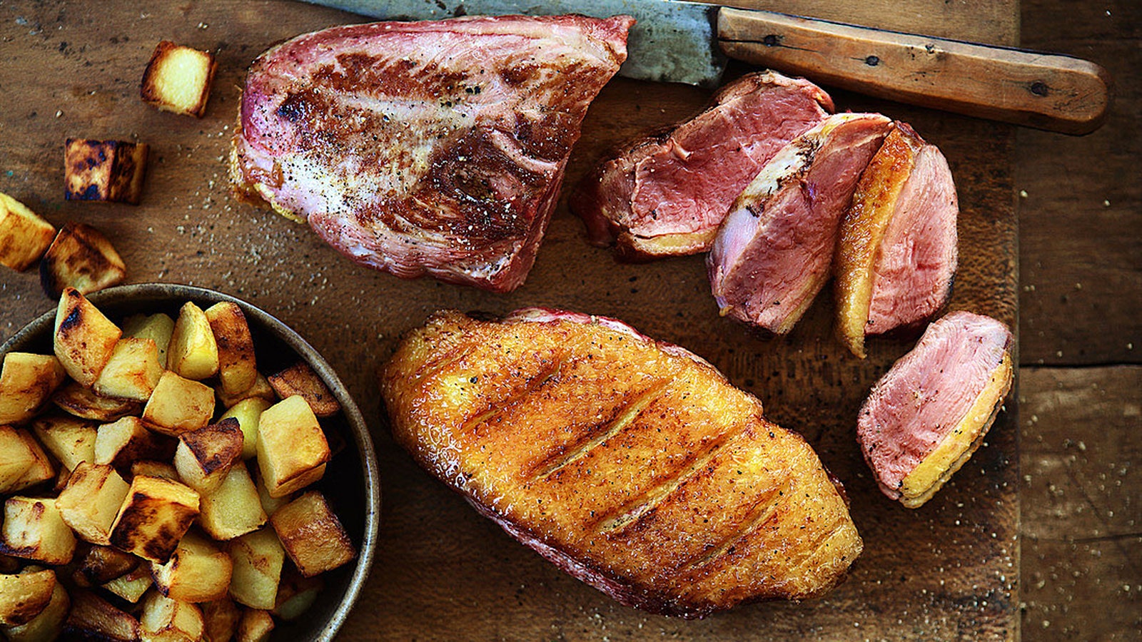 Seared duck breasts with cubed potatoes fried in the duck fat